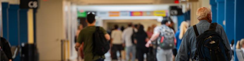 people walking in the terminals at the airport