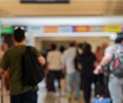 people walking in the terminals at the airport