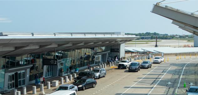taxis and rideshares dropping people off at the aiport